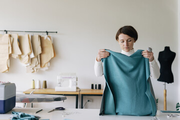 Preparation. Skillful needlewoman. Focused. Workspace. Craft