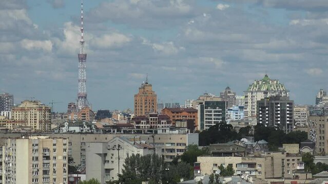 2022 - establishing shot rooftops and office buildings of downtown Kyiv, Ukraine with TV tower distant.