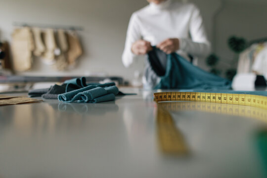 Measuring tape. Seamstress worktable. Fabric. Textile business