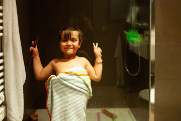 Funny kid after shower at bathroom