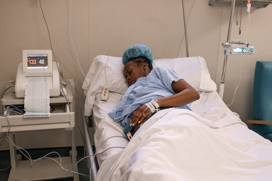 Pregnant black woman enduring contractions