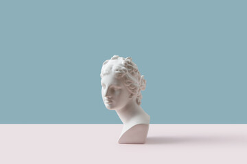 Vintage bust against blue and white background.