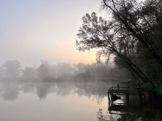 A beautiful sunrise at autumn lake and forest