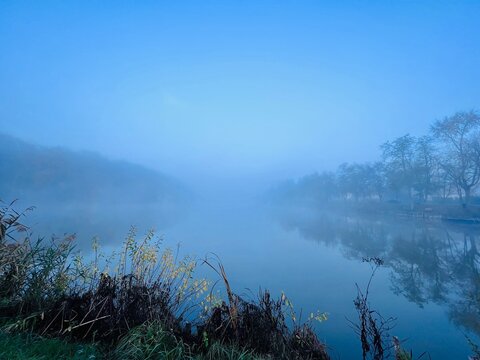 A beautiful sunrise at autumn lake and forest