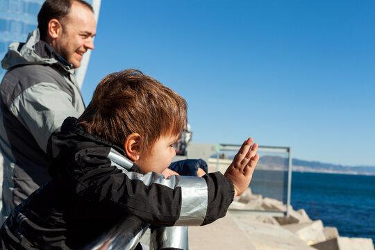 young kid waving goodbye