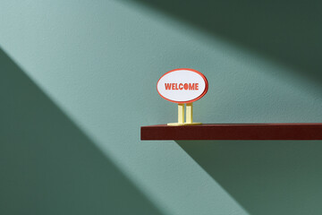 Welcome sign hanging on wall