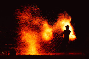Naklejka premium Fire show silhouettes 