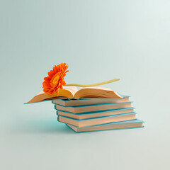 Aesthetic composition of books with colorful flowers on a pastel blue background. Spring or summer...
