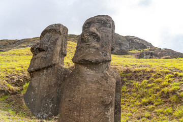 Moai Ko Kona He Roa (on the right) statue features a carving of a European ship on its front at Rano Raraku on Easter Island (Rapa Nui),  Chile. 