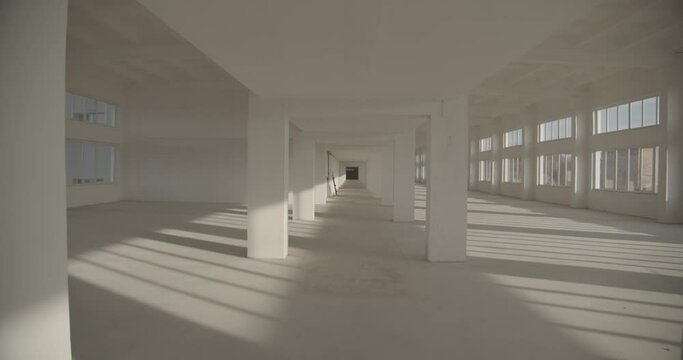 Large empty industrial premises with light walls