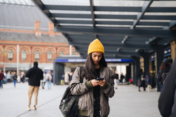 Woman Using Phone On The Street