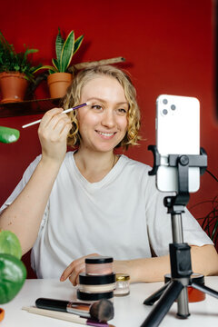 Female blogger shooting makeup tutorial