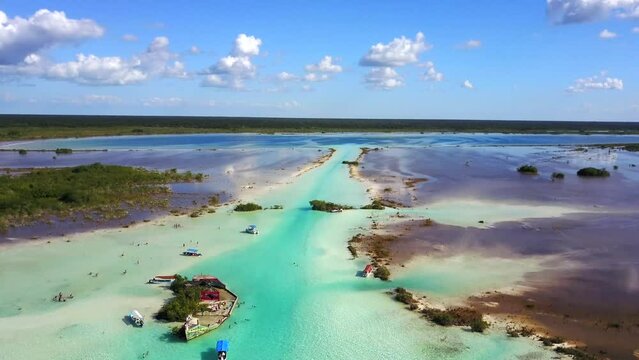 Bacalar,Quintana Roo, Mexico-Nov.27th 2017: drone view descent over the canal de los piratas of Bacalar Lagoon of 7 colors with blue turquoise waters, blue sky and white clouds