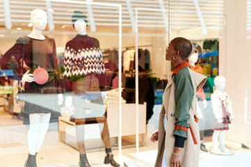 Woman window shopping in a mall