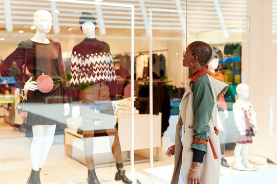 Woman window shopping in a mall