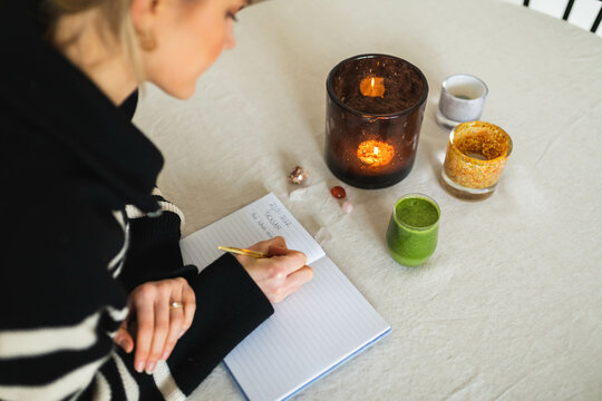 Woman writing in a book