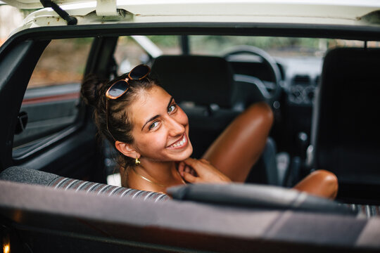 Young female smiling in a car