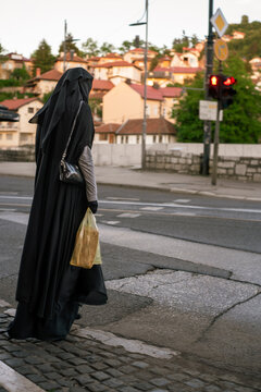 Muslim woman wearing burqa in the street of Sarajevo