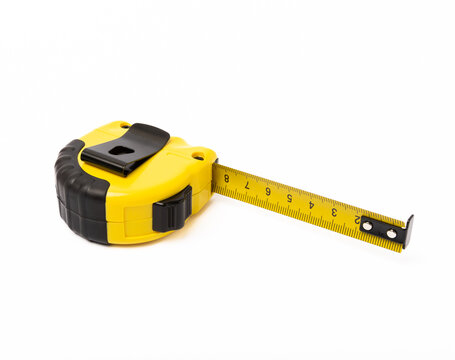 Yellow measuring tape isolated on white background. Construction concept. Builder's tools.