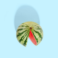 Cut watermelon on blue pastel background