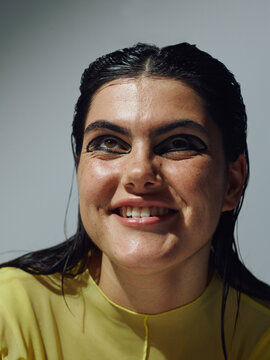 Girl with bold make up smiling