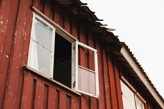 Rustic house with a broken window