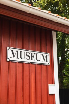 A sign on a house wall