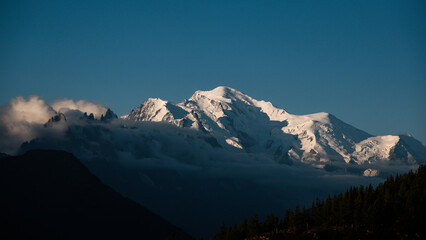 Landscape of Mont Blanc massif over the clouds at sunrise.