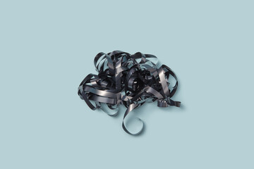 Black audio cassette tape shaped like cloud.