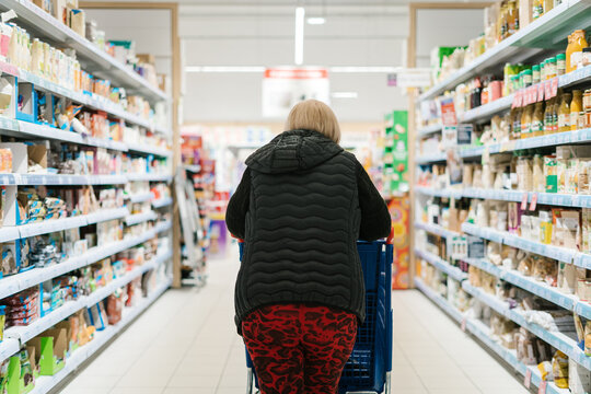 Woman choosing products in supermarket