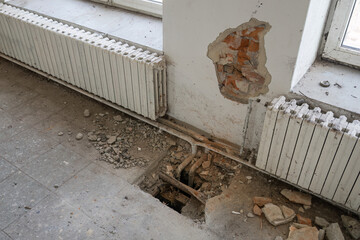 Broken part of the floor in the interior.