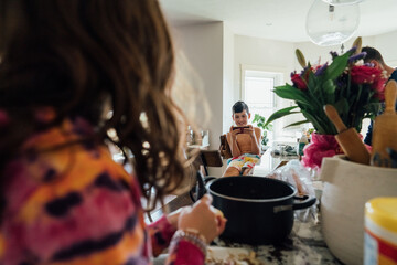 A kitchen cluttered with the mess from cooking. 