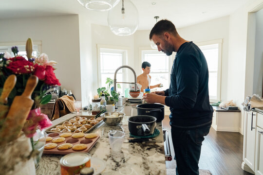 A father preparing a meal for Thanksgiving. 