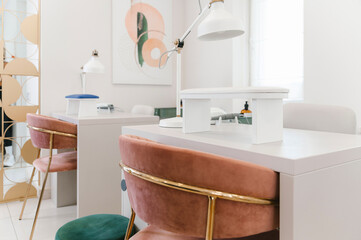 Lamp and arm rest pillow on table in nail bar