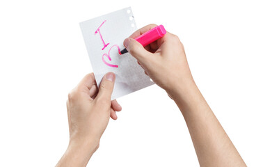 Hands writing a love note using a pink marker, cut out