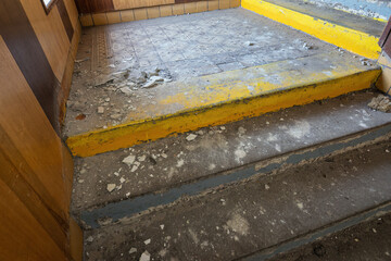 Pieces of plaster on the staircase.