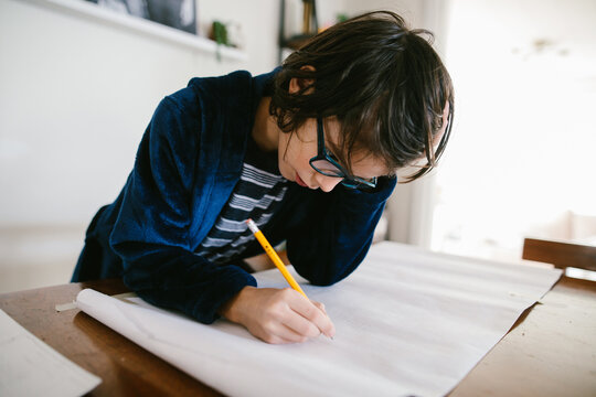 Boy does homework at home