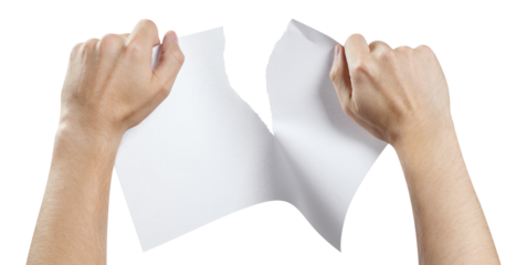 Hands tearing a sheet of white paper in half, cut out