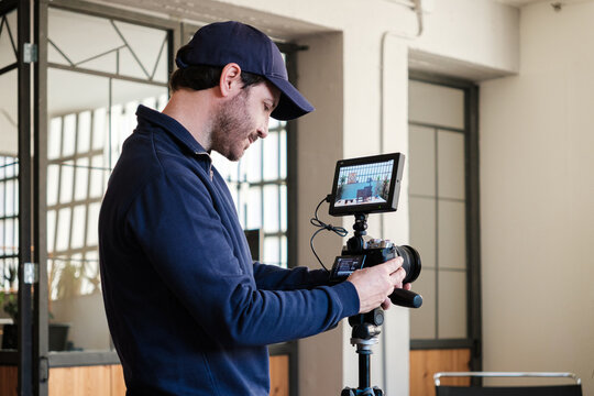 Man Setting Up Camera For Livestream