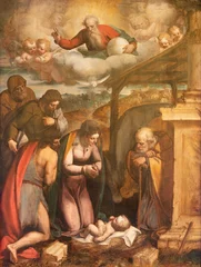 Deurstickers GENOVA, ITALY - MARCH 7, 2023: The painting of Nativity with the saints (Francis de Paul, Bartholomew, Baptist) in the church Chiesa di Francesco da Paola by Luca Cambiaso (1527 - 1585). © Renáta Sedmáková