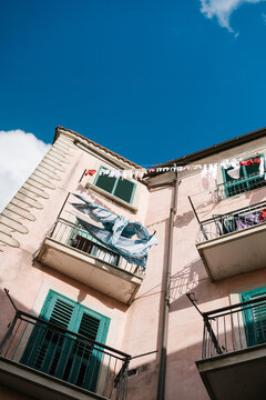 House with drying clothes on balconies
