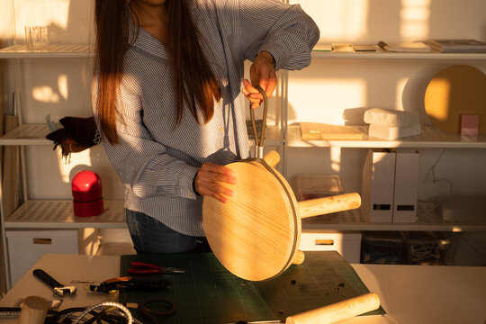 Cropped Image of Female Carpenter Making Wooden Stool 