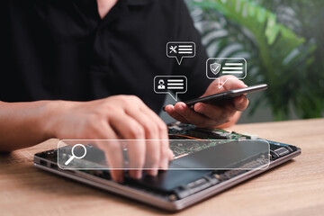 Customer Satisfaction Guarantee online concept,Man use smartphone chat with customer service search product warranty information via Internet of laptop service for preliminary inspection before repair