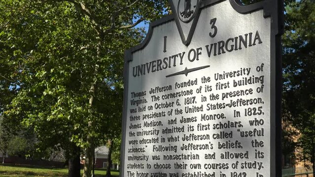 2022 - establishing shot of the Rotunda and historical sign on the University of Virginia campus.