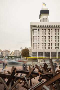 City traffic and people blurred in motion