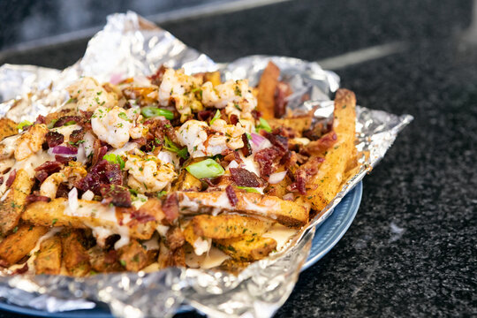 Fries Topped With Butter Poached Lobster And Cheese Sauce