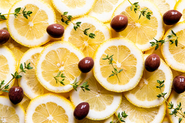 Fresh food ingredients with lemon, olives and herbs