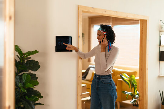 Woman using device in smart home