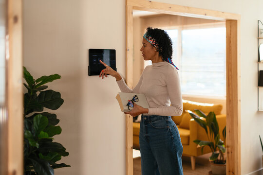 Woman using device in smart home