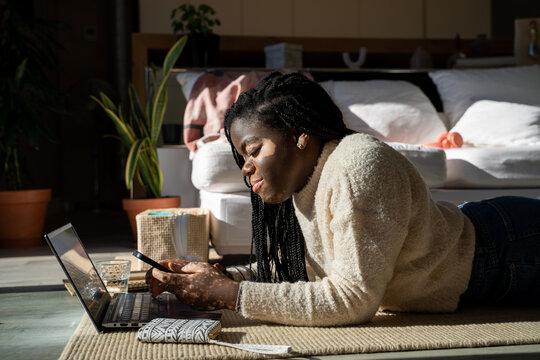 Teenager online shopping on laptop at home